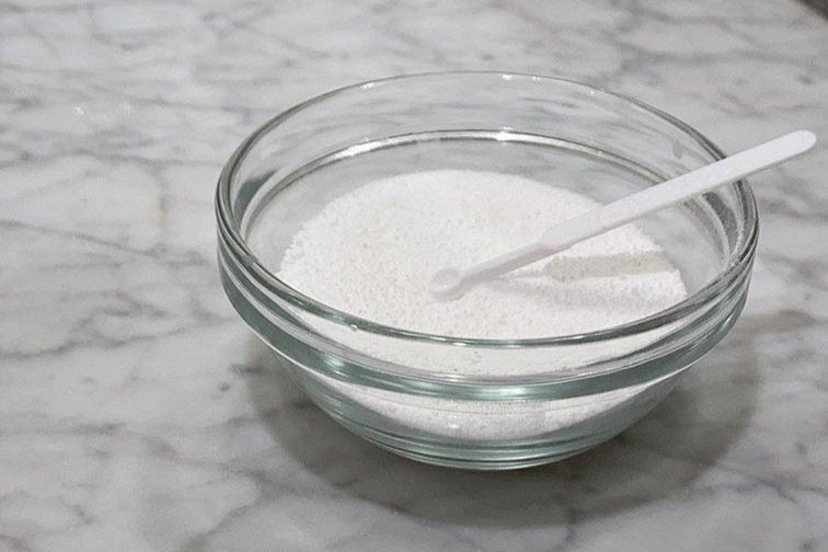 Image of Boron to explain benefits. A glass bowl filled with white powder and a small measuring spoon on a marble countertop, representing a powdered supplement or ingredient. Click to learn more. 