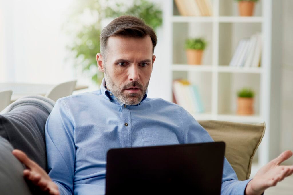 Did You Know Boron Could Enhance Your Cognitive Function? 1 a man sitting in a chair looking at a laptop, stressed, tired. Could Boron be his answer to power up his cognitive function?