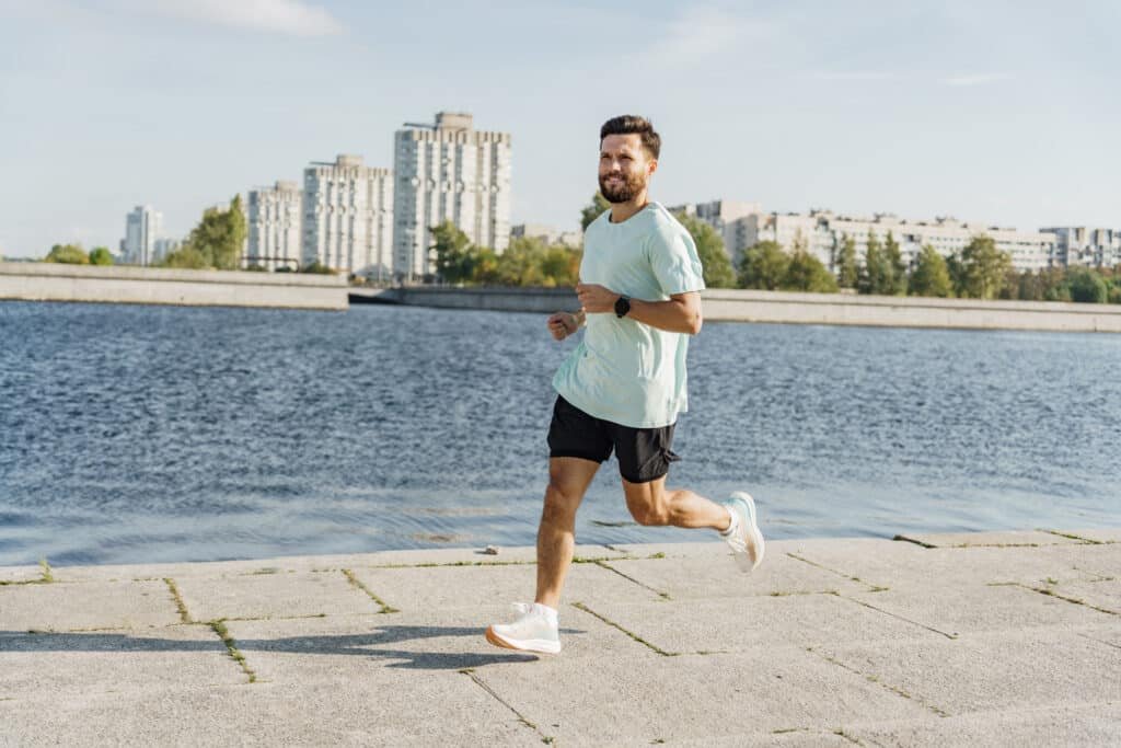 Health man running with improved cardiovascular health and lower blood pressure by supplementing with L-Theanine