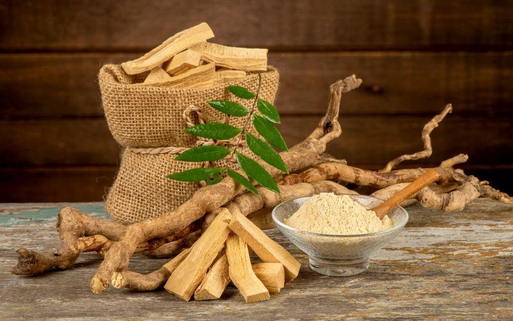 Image to show benefits of Tongkat Ali | Long Jack.  Tongkat Ali roots, cut roots, leafs, cut roots in burlap brown bag, powder in glass bowl with wooden spoon. Click to Learn More. 